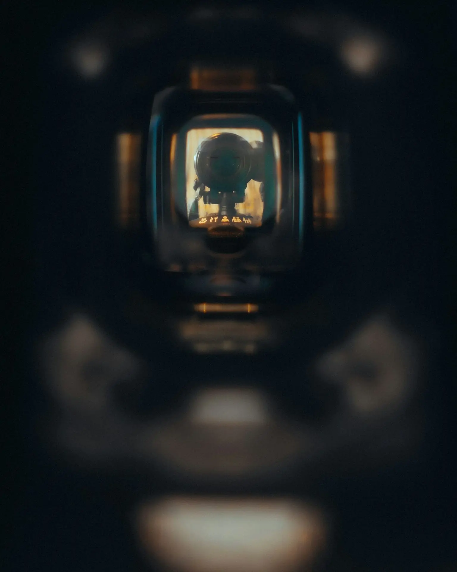 A skull reflected in a tiny, dark window.
